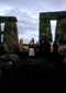 Stonehenge. Bluestone menhir in foreground with sarsen trilothon in background.