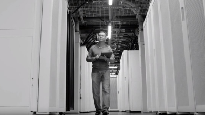 man walking through supercomputer cedar