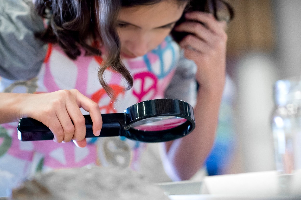image of school age student with microscope