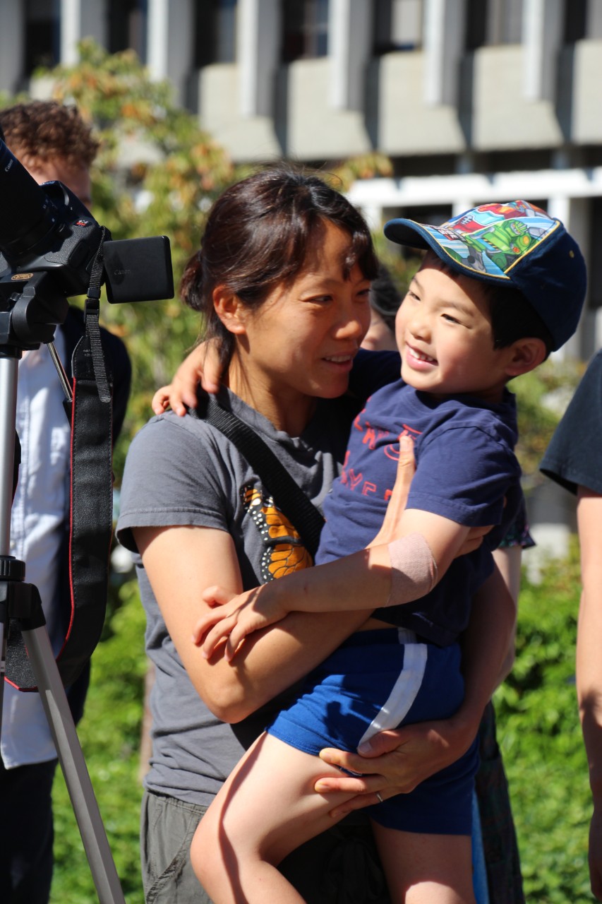 Truong with her young son at a Trottier Observatory public event