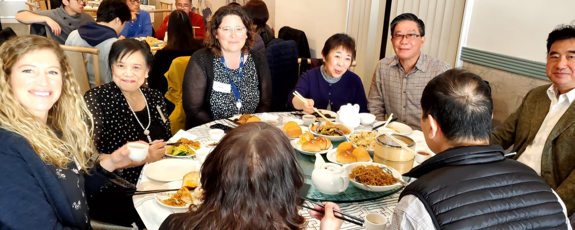 Members of the All Our Voices engagement team and community share a dim sum lunch together