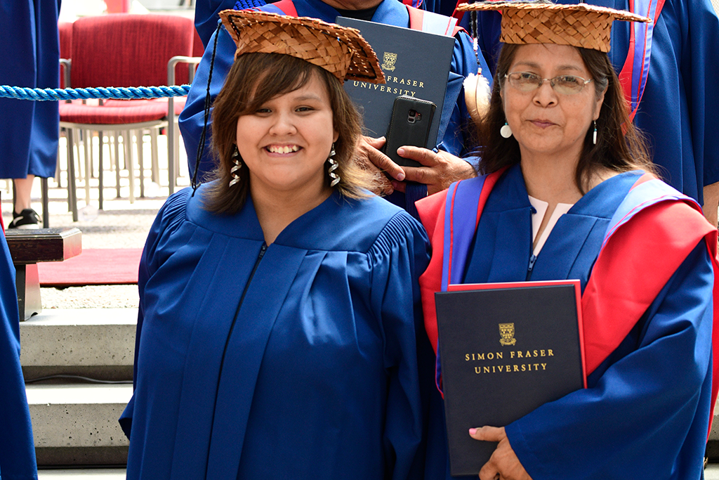 Martina Joe (left) received her Certificate for proficiency in a First Nations Language at convocation in 2019, alongside her aunt Bernadette Sam who received her master’s degree. Photo: Cim MacDonald
