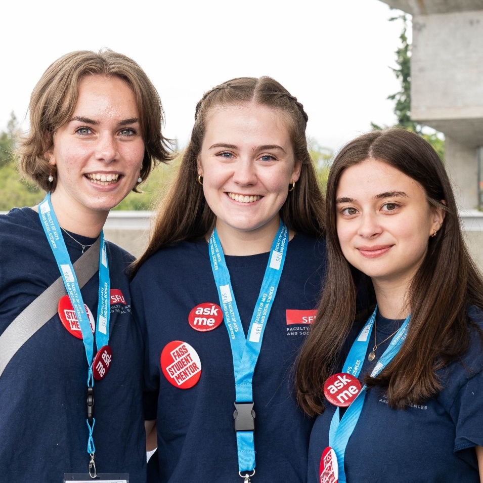 An image of three FASS Peer mentors photographed in Convocation Mall on SFU Burnaby Campus.