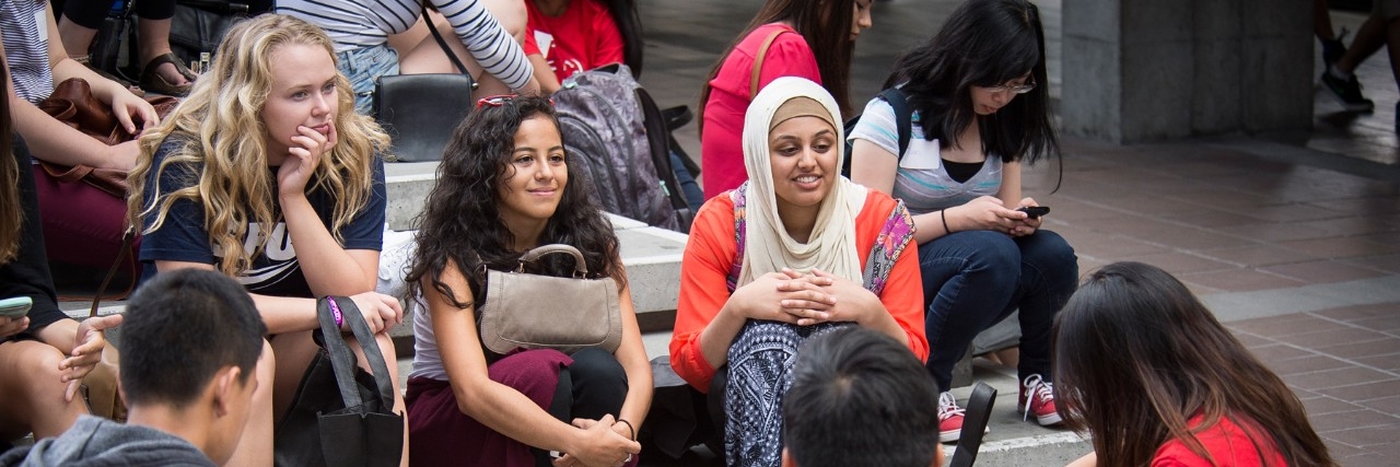 multicultural group of students gathered in Convocation Mall