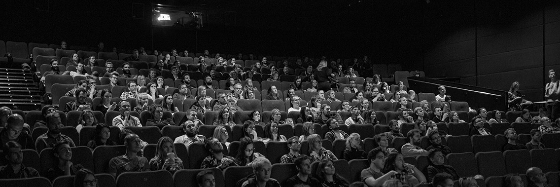 Audience watching a movie in images theatre at Burnaby campus