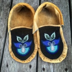 Pair of moccasins with blue floral beaded design