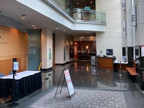 Large open lobby space with check-in desk and Security desk