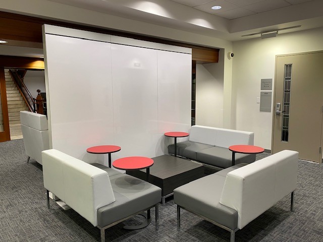 Open study space with tables and couches