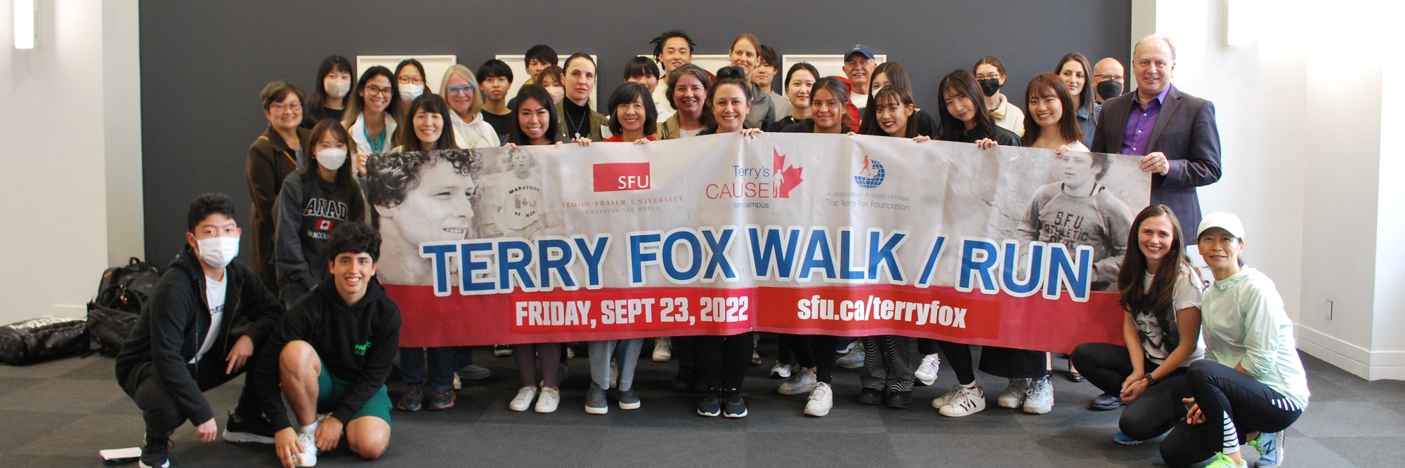 Group of people holding a large banner at 2022 Vancouver campus Terry Fox Walk/ Run 