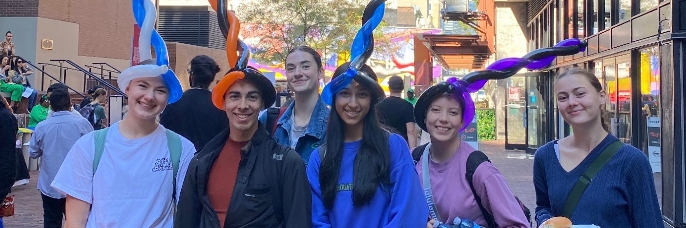 Group of students wearing balloon hats at the 2023 Welcome Back BBQ