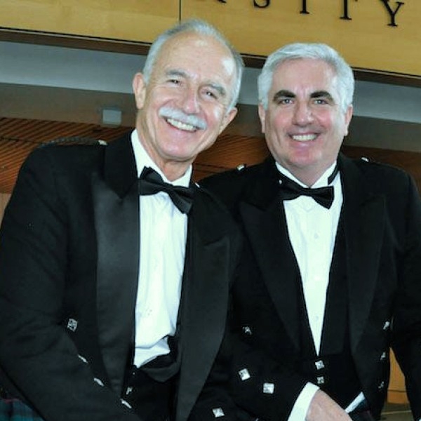 Laurie Anderson, Executive Director of SFU’s Vancouver campus, and Steve Dooley, Executive Director of SFU's Surrey campus, smiling and dressed up in tuxedoes