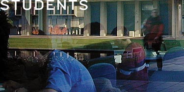 'Students' & reflections of students studying in a window