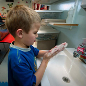 Child washing their hands