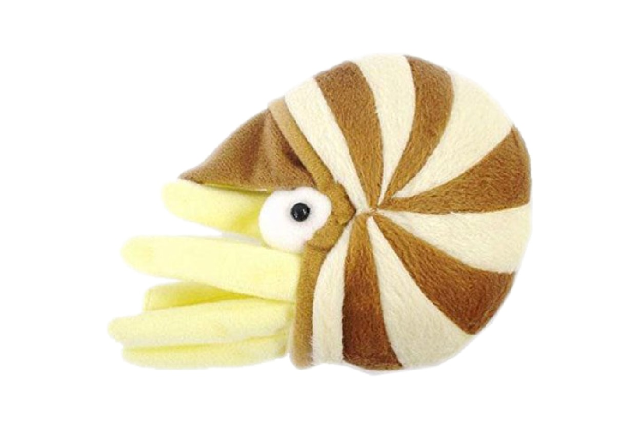 A yellow nautilus plush with a striped shell interchanging between brown and light brown