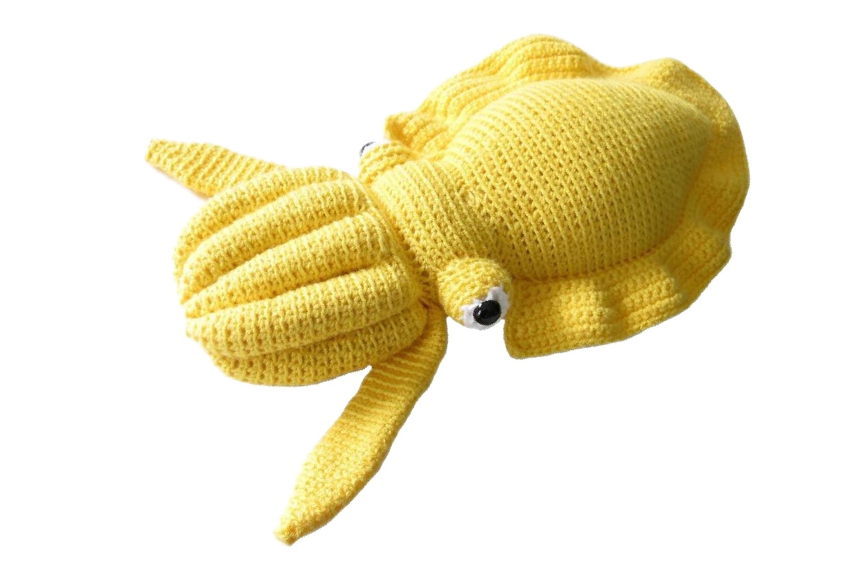 A yellow knitted cuttlefish plush
