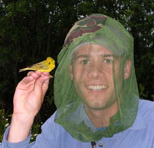 Sam holding a Yellow Warbler