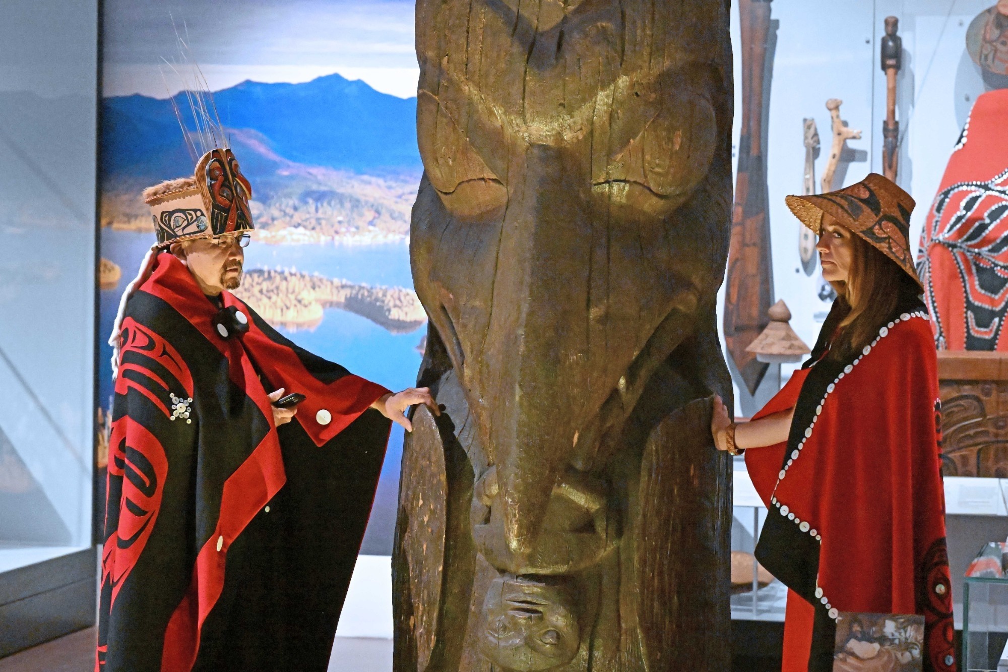 Sim’oogit Ni’isjoohl (Chief Earl Stephens) and Noxs Ts’aawit (Dr. Amy Parent) stand with the Ni'isjoohl memorial pole in the National Museum of Scotland on August 22, 2022
