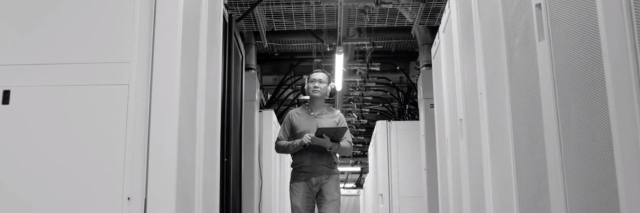 Simon Fraser university professor jian pei walking through supercomputer cedar