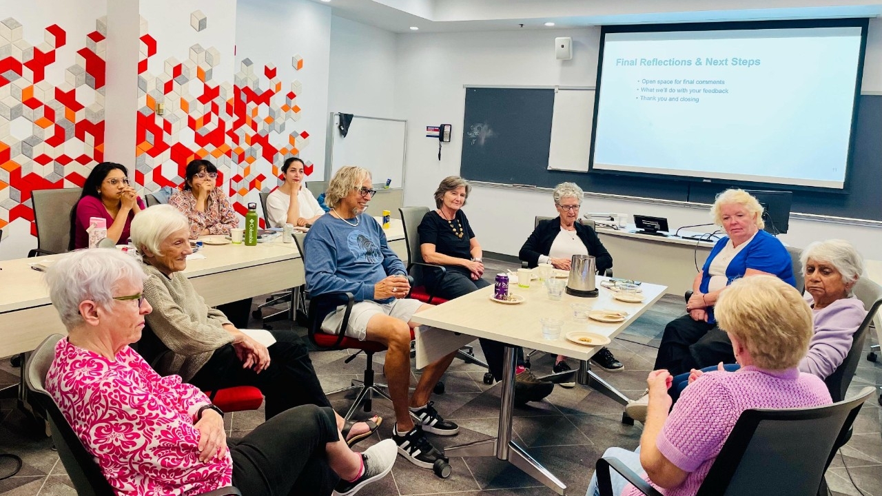 Older Adult male smiling and talking