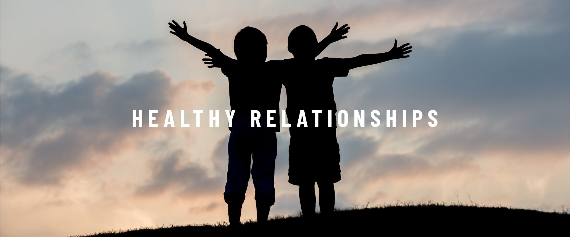 Image: Shadow of two children together Text: Healthy relationships