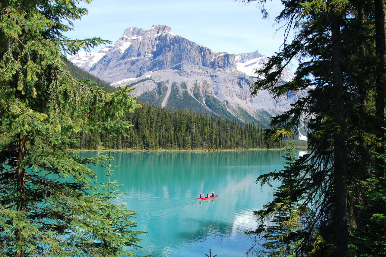 Majestic mountain lake scenery with a canoe