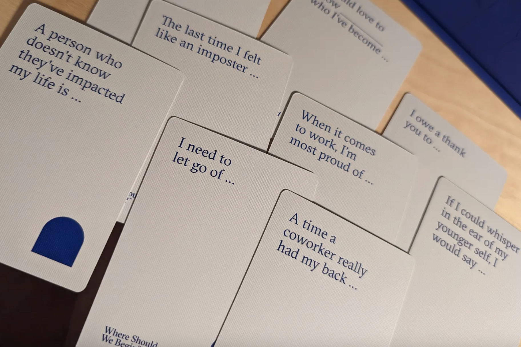 Cards from Esther Perels's "Where Should We Begin: A Game of Stories" card game laid on a table.