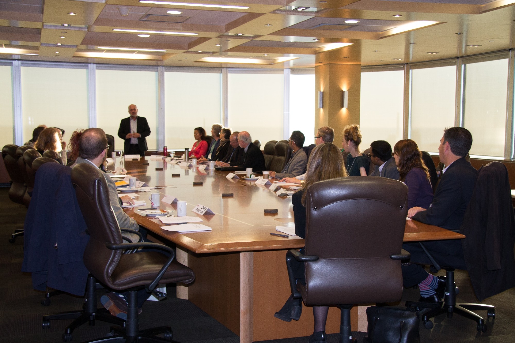 Participants of the Climate Action Competitiveness Business Roundtable sitting around a boardroom table