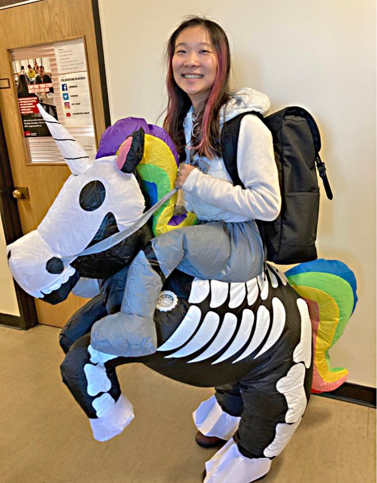 Isabella Wang wearing an inflatable unicorn costume