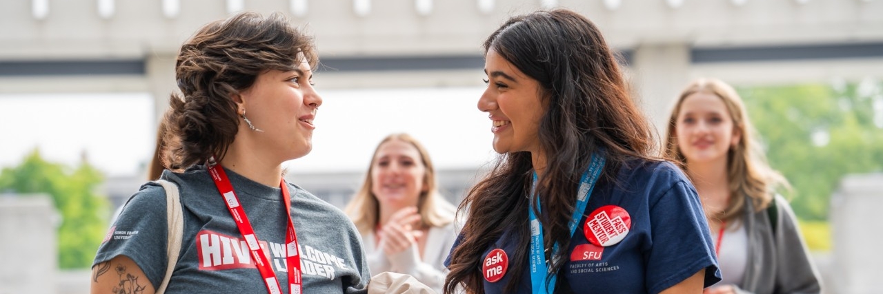 A FASS Hive leader and FASS student mentor talk during SFU Welcome Day