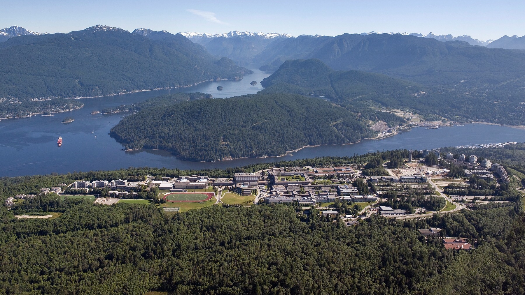 Aerial view of Burnaby Mountain, which in Sḵwx̱wú7mesh (Squamish) is known as Lhuḵw’lkuḵw’áyten, meaning "where the bark gets pe[e]led in the spring."