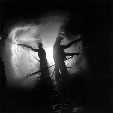 Teck Gallery, Louie Palu, Drilling a cross-cut on a ramp, 1750 foot level, Kerr Mine, Virginiatown, Ontario 