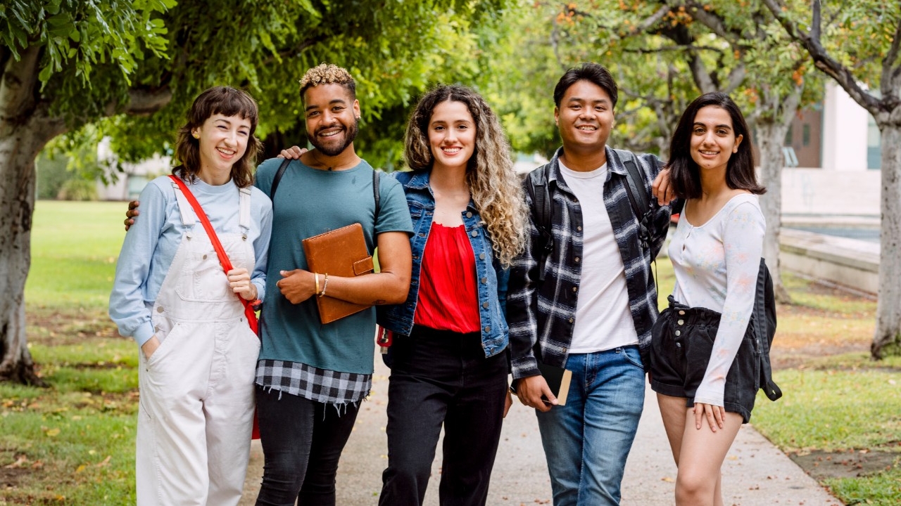 Diverse university students at campus in summertime