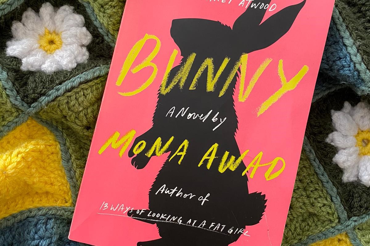 A copy of Bunny by Mona Awad lying on a crochet blanket. 