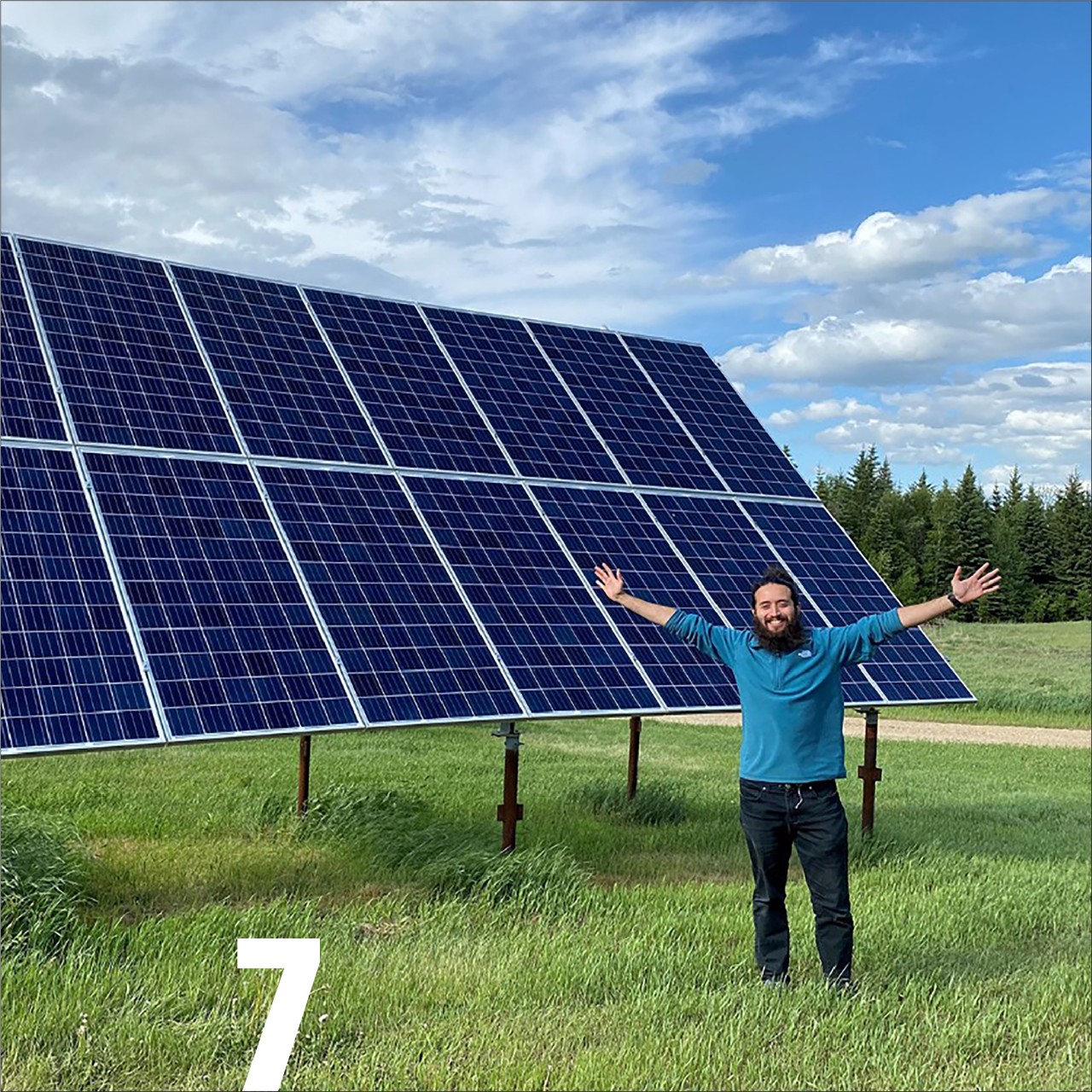Gabriel Soares standing in front of solar panel