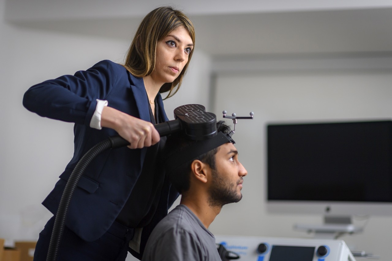 Faranak Farzan, Professor in SFU's Faculty of Applied Sciences and a member of the INN's Steering Committee, operates a Transcranial magnetic stimulation (TMS) at Surrey Memorial Hospital