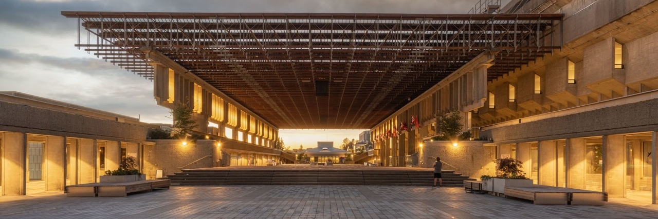 Convocation Mall at Simon Fraser University with a clear sky in the background.