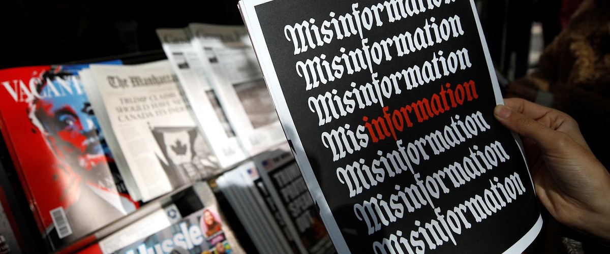 In the background there is a newspaper stand, in the foreground there is a newspaper with the word "Misinformation" repeating on the front cover. PC Atilgan Ozdil/Anadolu Agency via Getty Images