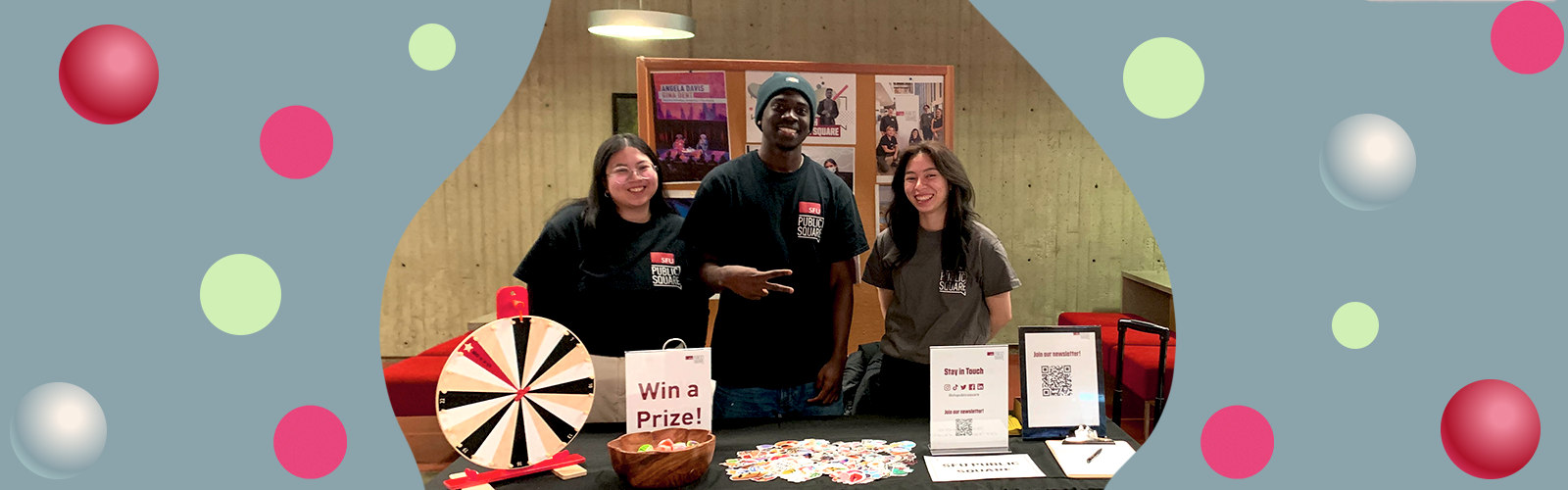 Image of three volunteers at the SFU Ready Fair with colourful illustrated circles and a blue background