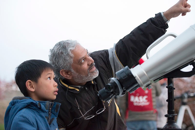 older man and child using a telescope, STARRY NIGHTS banner