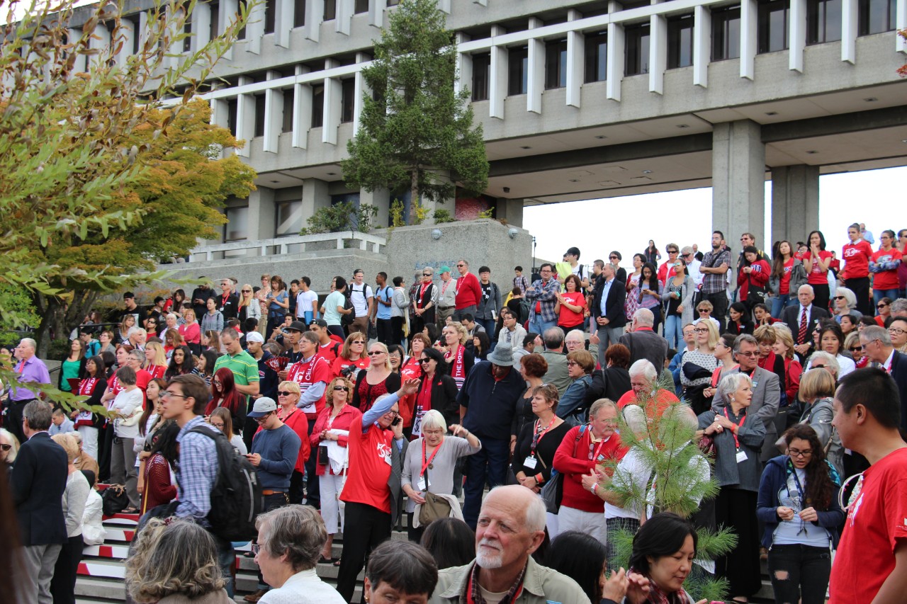 crowd standing on convocation hall steps