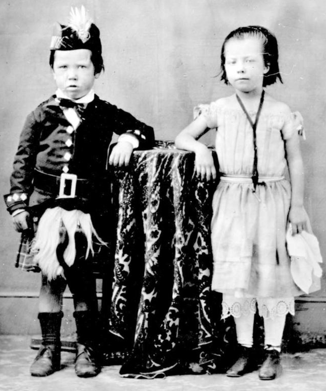 black and white photo of two children in Scottish clothing
