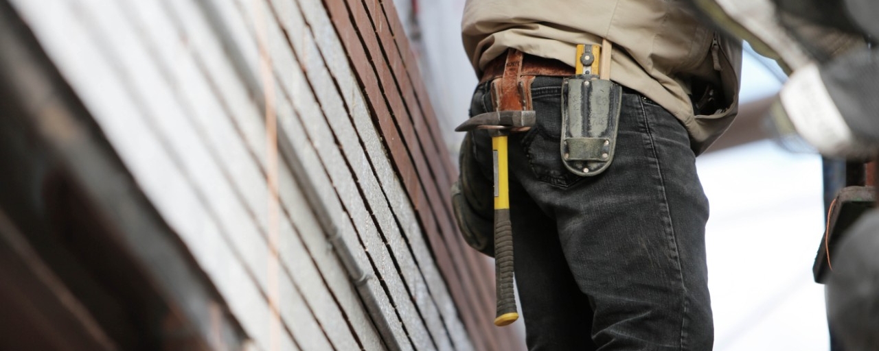 photo of construction worker with a tool-belt