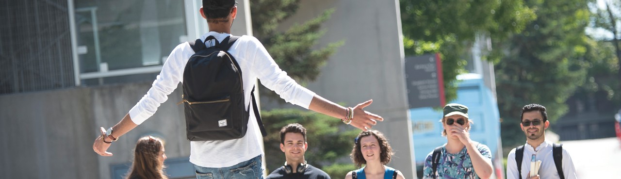 SFU resident greeting his new residence friends with open arms on move in day. 