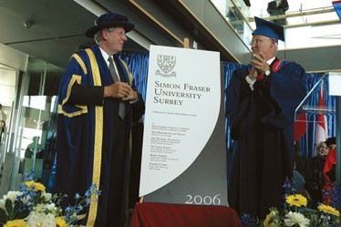 Former Simon Fraser University President Michael Stevenson and former B.C. Premier Gordon Campbell unveil the plaque officially opening SFU's Surrey campus on Sept. 8, 2006. Photo from SFU News Archives.