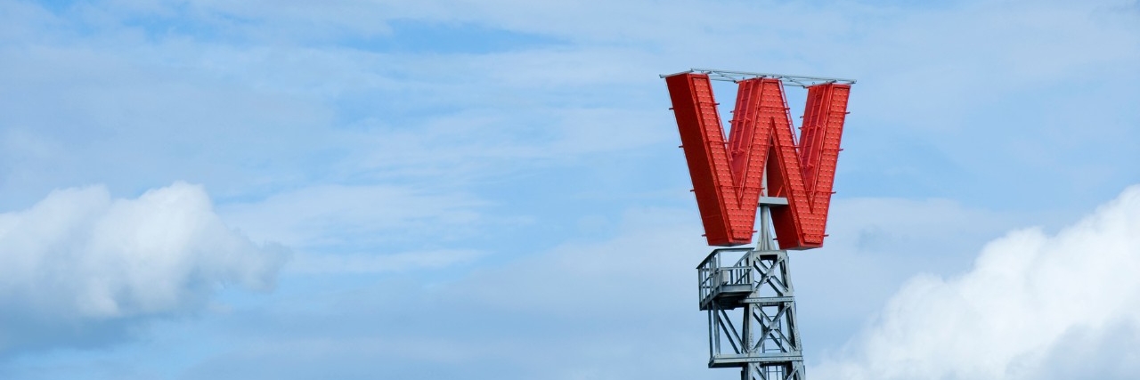 Woodwards' W sign on a blue background; header: news archive