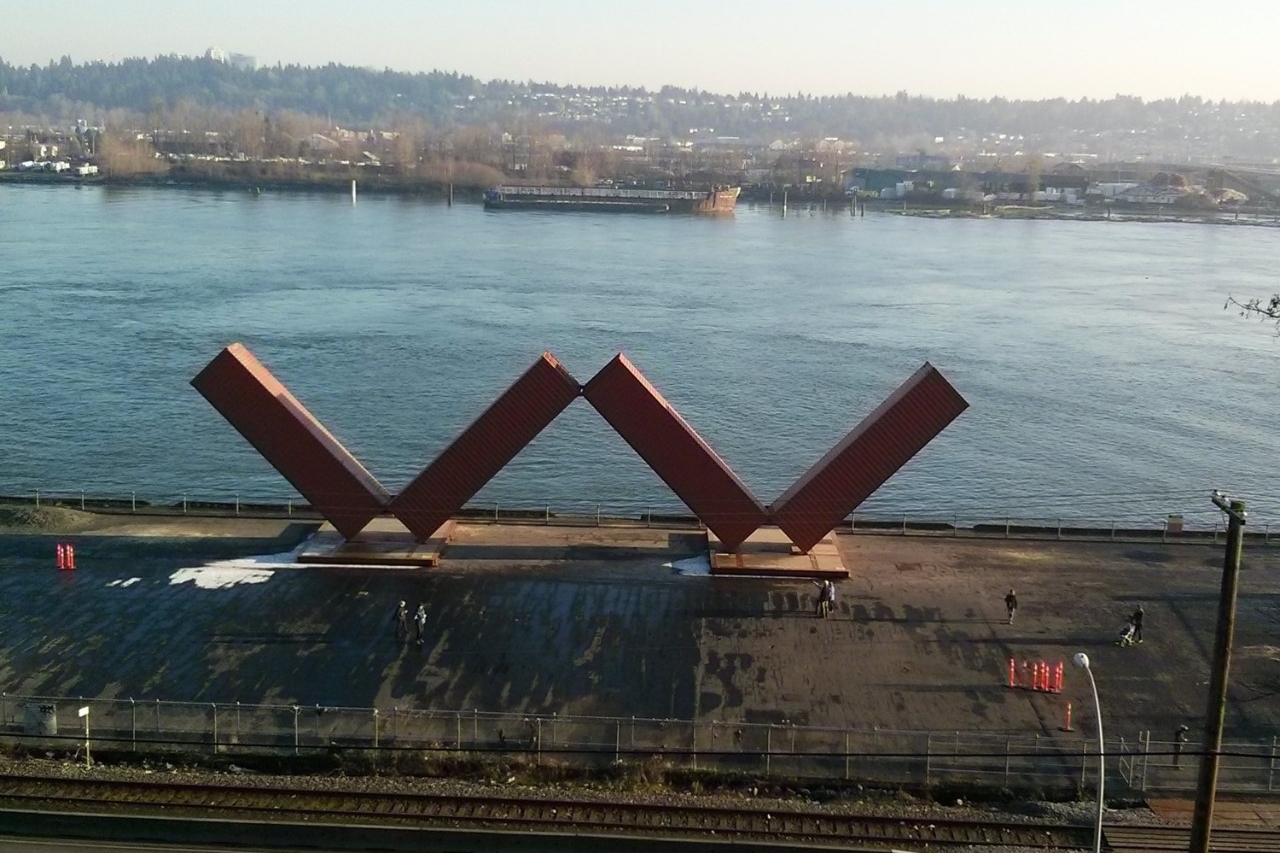 View of the river in New Westminster with containers shaped like a W on the landing; header: Working Waterfront