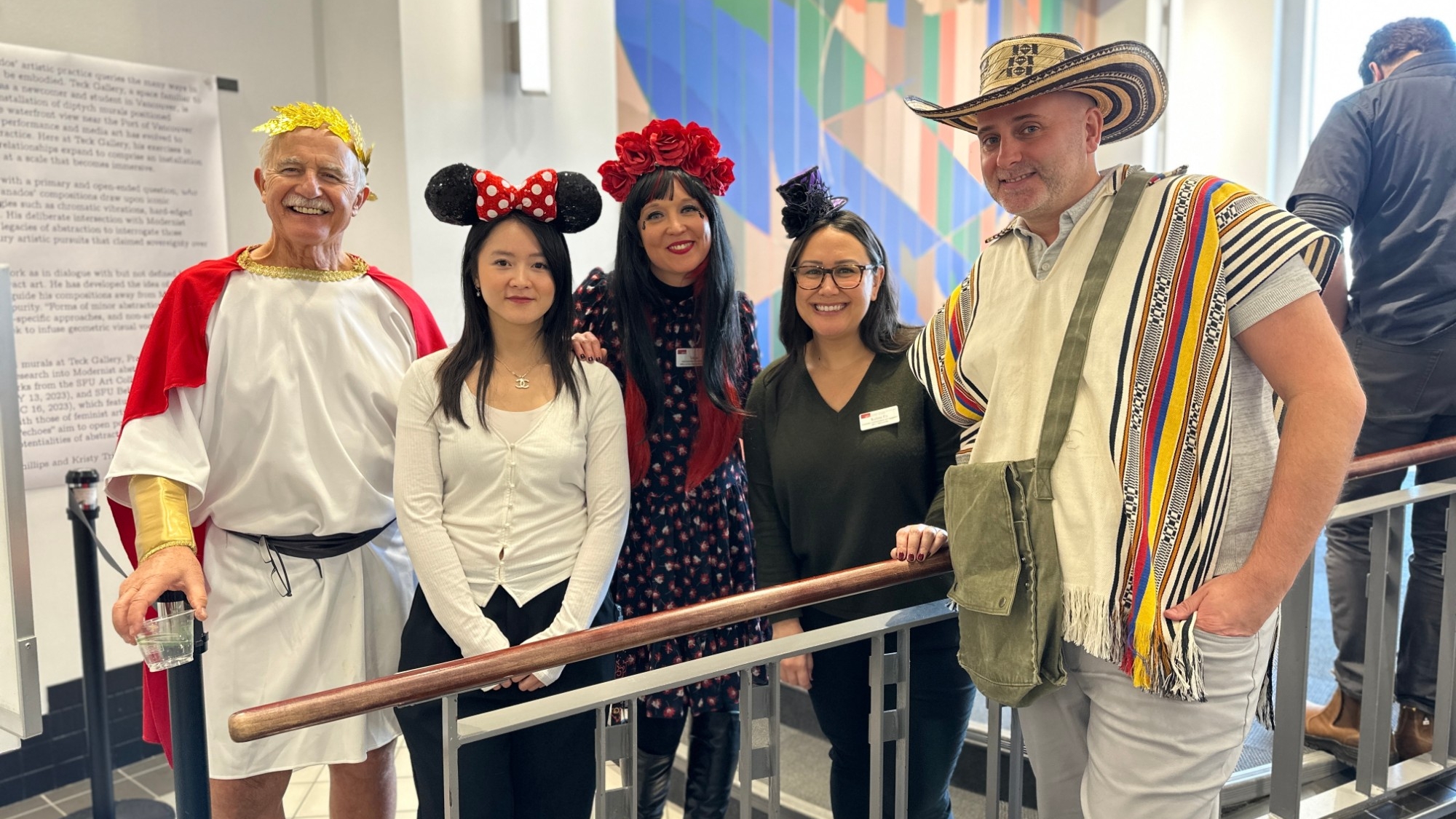 Group of staff members dressed up in various costumes at 2023 Halloween Social