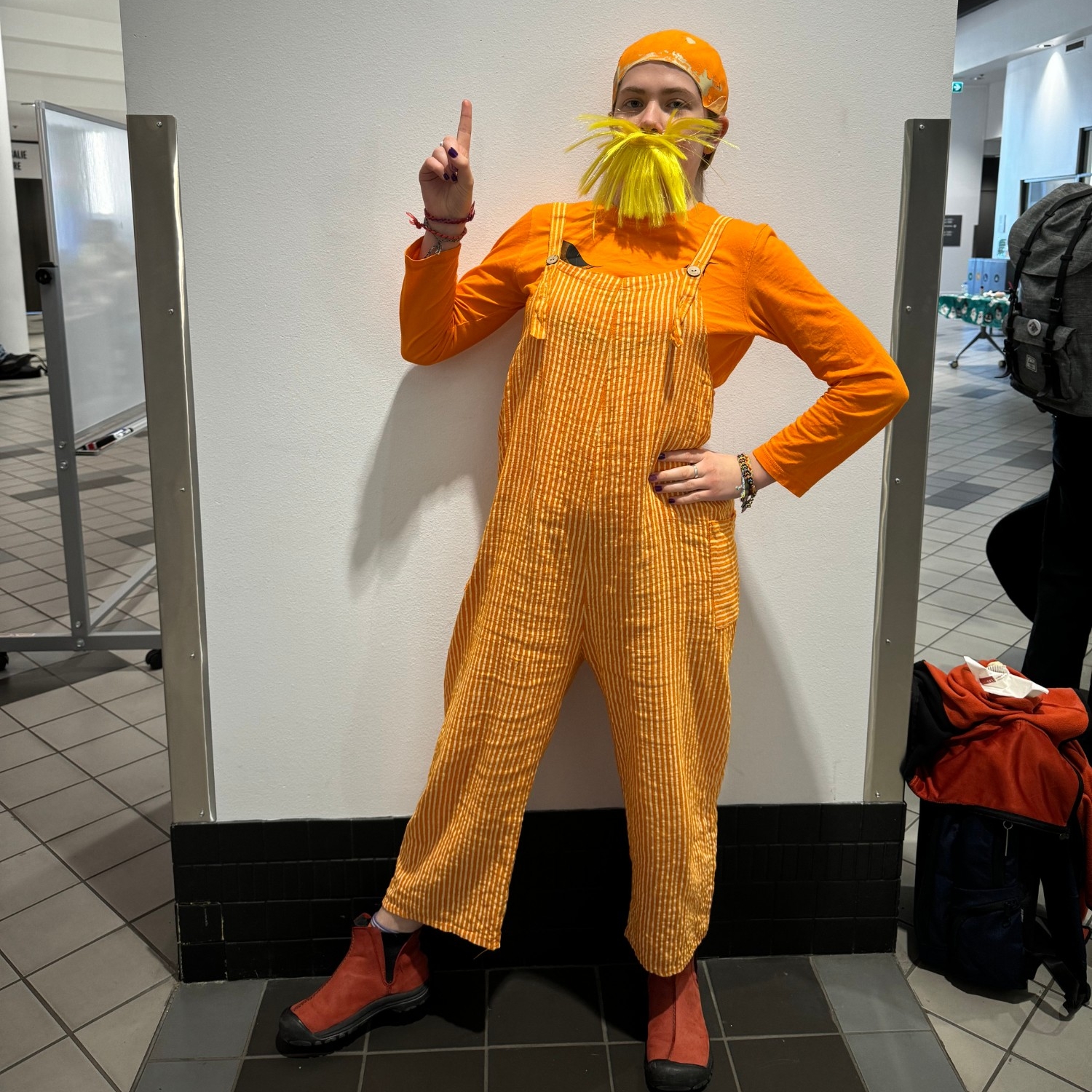 Person dressed up as The Lorax from the Dr. Seuss book, at 2023 Halloween Social