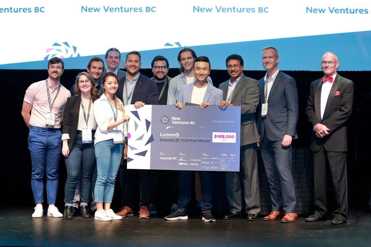Lumen5, headed by CEO Michael Cheng (centre), an SFU SIAT alumnus—and early client of Coast Capital Savings Venture Connection— receives the top prize in this year's New Ventures BC competition.