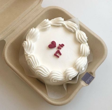 white cake with 17 written on it in a box